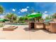 Outdoor kitchen, fire pit, lounge furniture, and sparkling pool make this backyard ideal for entertaining at 10105 E Larkspur Dr, Scottsdale, AZ 85260