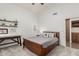 Cozy bedroom featuring neutral paint, a ceiling fan, carpet flooring, and built in shelving at 10105 E Larkspur Dr, Scottsdale, AZ 85260