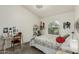 Brightly lit bedroom featuring a window and desk area at 10105 E Larkspur Dr, Scottsdale, AZ 85260