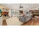 Open-concept living room showcasing a fireplace, cozy seating, and seamless flow to the kitchen for easy entertaining at 10105 E Larkspur Dr, Scottsdale, AZ 85260