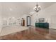 Expansive living room with abundant natural light, hardwood floors, and elegant furnishings, ideal for comfortable living at 10105 E Larkspur Dr, Scottsdale, AZ 85260