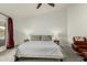 A relaxing main bedroom with carpeted floors, soft lighting, and simple decor at 10105 E Larkspur Dr, Scottsdale, AZ 85260