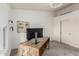 Well-lit office featuring modern decor, neutral walls, and desk area at 10105 E Larkspur Dr, Scottsdale, AZ 85260
