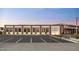 The Italian restaurant exterior with brick and large windows and parking lot at 10105 E Larkspur Dr, Scottsdale, AZ 85260