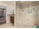 New tile shower behind glass enclosure, featuring built in shelves at 10105 E Larkspur Dr, Scottsdale, AZ 85260