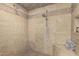 Updated tile shower featuring built in shower seat, tile accents and modern shower head fixture at 10105 E Larkspur Dr, Scottsdale, AZ 85260