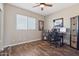 Bedroom with hardwood floors and desk at 10448 E Conieson Rd, Scottsdale, AZ 85255
