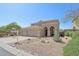 Two-story home showcases desert landscaping and arched entryway at 10448 E Conieson Rd, Scottsdale, AZ 85255