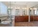 Elegant main bathroom features a soaking tub, walk-in shower, dual sinks, and closet at 10448 E Conieson Rd, Scottsdale, AZ 85255