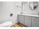 Clean bathroom featuring a toilet and vanity sink with a framed mirror and neutral decor, ideal for relaxation at 120 N Val Vista Dr # 178, Mesa, AZ 85213
