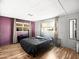 Cozy bedroom with comfortable bed, laminate flooring, and natural light at 120 N Val Vista Dr # 178, Mesa, AZ 85213