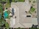 Aerial shot showcases tile roof of desert home with a private swimming pool and mature landscaping in a great neighborhood at 12183 E Mercer Ln, Scottsdale, AZ 85259