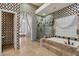 Beautiful bathroom with tile detail, including bathtub and glass enclosed shower at 12183 E Mercer Ln, Scottsdale, AZ 85259
