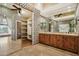 Elegant primary bathroom with dual sinks, ample cabinet space, and mirrored closet at 12183 E Mercer Ln, Scottsdale, AZ 85259