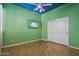 Unique ' bedroom, vibrant and functional, with ceiling fan and TV at 12183 E Mercer Ln, Scottsdale, AZ 85259