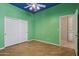 Bright, airy room featuring hardwood floors, closet and open entrance at 12183 E Mercer Ln, Scottsdale, AZ 85259
