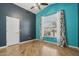 Comfortable bedroom with bright walls, a large window, and stylish curtains at 12183 E Mercer Ln, Scottsdale, AZ 85259