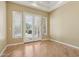 Bedroom with wood floors and French doors that have direct access to the pool at 12183 E Mercer Ln, Scottsdale, AZ 85259