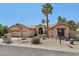 Stunning single-story home with desert landscaping, palm trees, and a convenient three-car garage at 12183 E Mercer Ln, Scottsdale, AZ 85259
