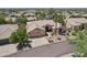 Stunning aerial view of desert home featuring a tile roof, mature landscaping and a three car garage in a beautiful community at 12183 E Mercer Ln, Scottsdale, AZ 85259