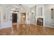 Grand foyer with a decorative chandelier, hardwood floors, and a large entry door at 12183 E Mercer Ln, Scottsdale, AZ 85259