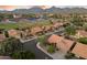 Lovely aerial view showcasing a charming neighborhood with lush greenery and nearby community baseball fields at 13361 N 99Th Pl, Scottsdale, AZ 85260