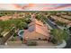 A neighborhood view featuring a pool, solar panels, desert landscape, and fenced yard at 13361 N 99Th Pl, Scottsdale, AZ 85260