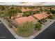 An elevated street view of a well-manicured neighborhood with terracotta roofs and desert landscaping at 13361 N 99Th Pl, Scottsdale, AZ 85260