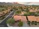 Captivating aerial view of a property showcasing its beautiful landscaping and the picturesque mountain backdrop at 13361 N 99Th Pl, Scottsdale, AZ 85260
