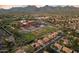 Community aerial view of a school with lush landscaping, baseball field, and nearby homes at 13361 N 99Th Pl, Scottsdale, AZ 85260