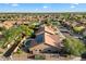 Beautiful aerial view of home with a pool and solar panels in a suburban neighborhood at 13361 N 99Th Pl, Scottsdale, AZ 85260