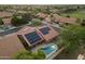 Aerial view of house with solar panels and a pool at 13361 N 99Th Pl, Scottsdale, AZ 85260