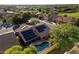 Aerial view of house with solar panels and a pool at 13361 N 99Th Pl, Scottsdale, AZ 85260