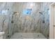 Elegant walk-in shower showcasing marble tiling, dual shower heads, and seamless glass at 13361 N 99Th Pl, Scottsdale, AZ 85260