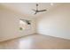 Spacious bedroom with a ceiling fan, a window with a view to the outside, and hardwood floors at 13361 N 99Th Pl, Scottsdale, AZ 85260