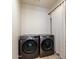 Laundry room featuring a front load washer and dryer and a curtain at 13361 N 99Th Pl, Scottsdale, AZ 85260