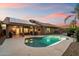 Inviting pool and patio area with solar panels on roof, perfect for outdoor entertaining at 13361 N 99Th Pl, Scottsdale, AZ 85260