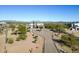 Stunning aerial view of a luxurious estate with a circular driveway and desert landscaping at 13648 E Aloe Vera Dr, Scottsdale, AZ 85262