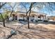 Expansive backyard with covered patio, spiral staircase, and desert landscaping at 13648 E Aloe Vera Dr, Scottsdale, AZ 85262