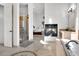 The primary bathroom is beautifully designed and features a glass enclosed shower, fireplace and soaking tub at 13648 E Aloe Vera Dr, Scottsdale, AZ 85262