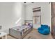 A room with neutral colored walls, a twin bed, and a blue bean bag chair at 13648 E Aloe Vera Dr, Scottsdale, AZ 85262