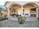 Inviting covered patio with stone pillars and tile flooring, perfect for outdoor entertaining at 13648 E Aloe Vera Dr, Scottsdale, AZ 85262