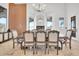 Elegant dining room with decorative lighting, large table, and views of the outdoors at 13648 E Aloe Vera Dr, Scottsdale, AZ 85262