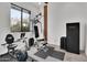 This exercise room features an exercise bike, a weight machine and a Stack-On gun safe at 13648 E Aloe Vera Dr, Scottsdale, AZ 85262