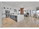 Gourmet kitchen features a large island, stainless steel appliances, and open dining area at 13648 E Aloe Vera Dr, Scottsdale, AZ 85262