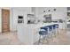 Bright and airy kitchen with a large white island, stainless steel appliances, and ample counter space at 13648 E Aloe Vera Dr, Scottsdale, AZ 85262