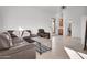 Spacious living room featuring modern furniture, tile floors, and natural light at 13648 E Aloe Vera Dr, Scottsdale, AZ 85262