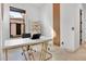 Bright office space features a white desk, gold shelving, and a decorative wood accent wall at 13648 E Aloe Vera Dr, Scottsdale, AZ 85262