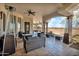 Large covered patio with comfortable seating, ceiling fans, and views at 13648 E Aloe Vera Dr, Scottsdale, AZ 85262