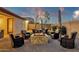 Relaxing backyard featuring a central fire pit and comfortable seating area at 16105 N 183Rd Dr, Surprise, AZ 85388